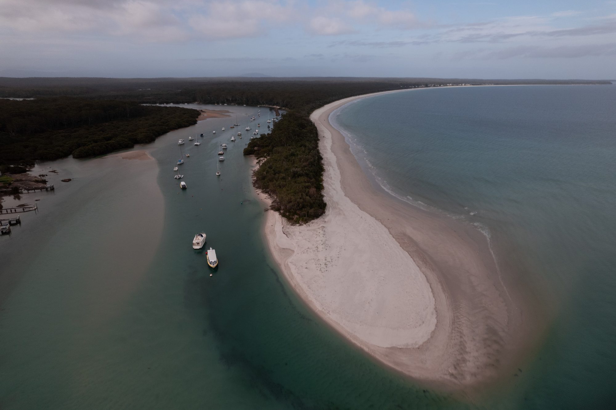 Aerial drone photo of a sand spit and moored boats